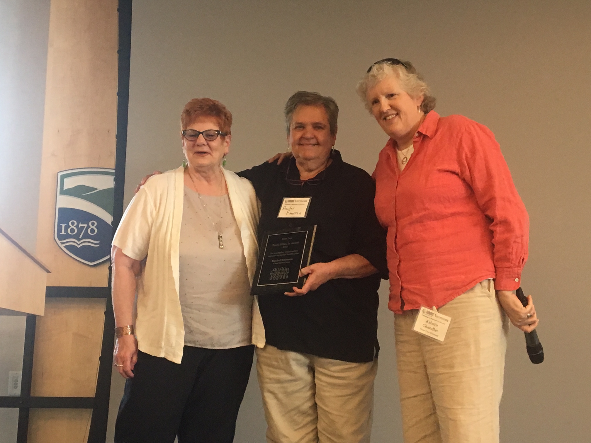 Rachel Emerson of the Clara Martin Center holding the Team Two Frank Silfies Award